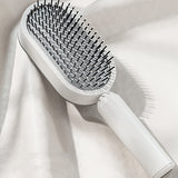 Self cleaning hair brush