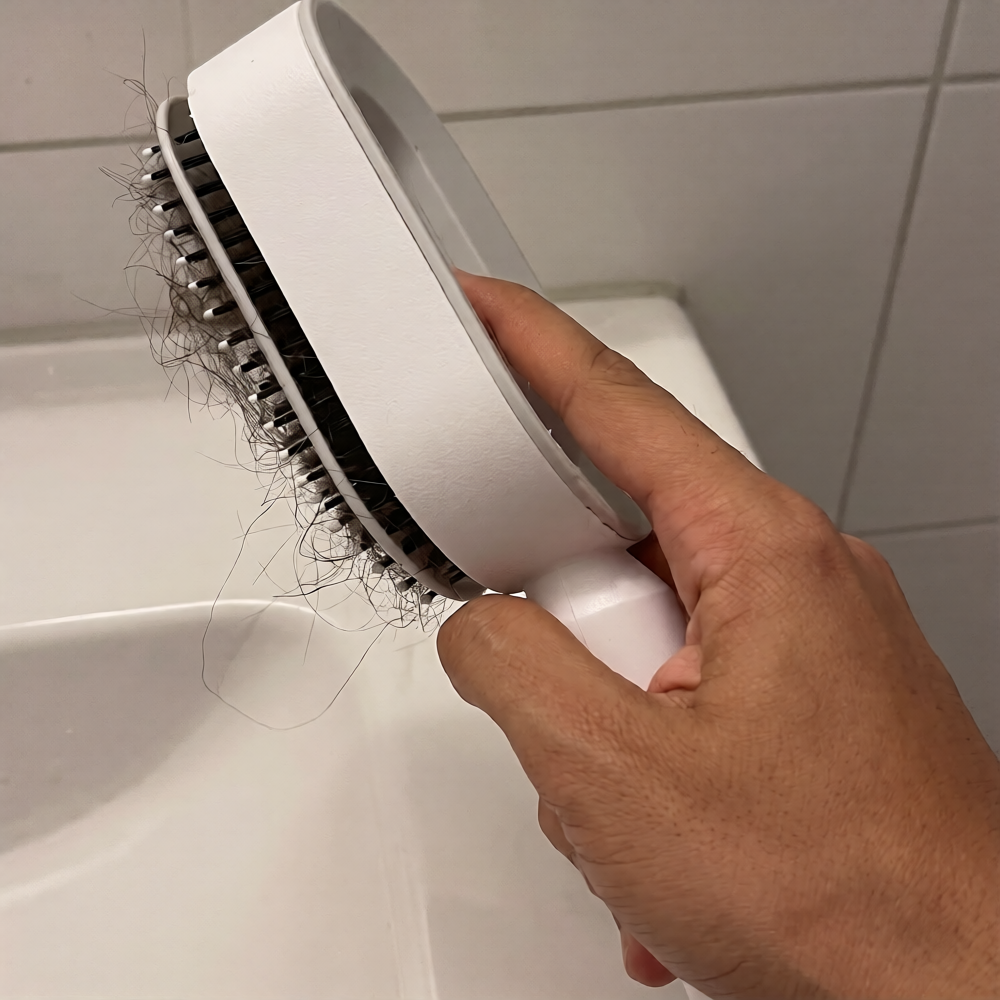 Self cleaning hair brush